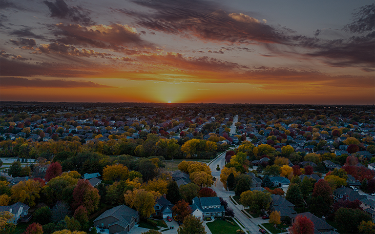 Fall sunset aerial view over a neighborhood. High quality photo Taken in October in the USA